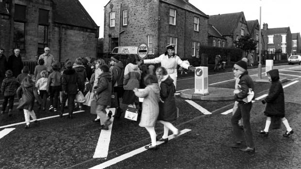 The Northern Echo: Children scurry to school across a Consett road in 1983